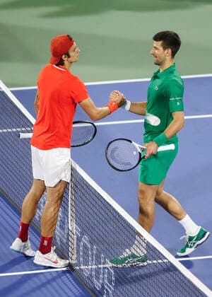 Lorenzo Musetti congratulates the winner Novak Djokovic SRB Tennis Dubai Duty Free Tennis Championships ATP Dubai Duty Free Tennis Stadium Dubai United Arab Emirates 21 February 2022 Copyright: xJuergenxHasenkopfx