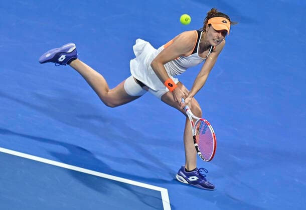 (220223) -- DOHA, Feb. 23, 2022 -- Aliz Cornet of France hits a return during the second round of WTA, Tennis Damen Qatar Open tennis tournament match against Aryna Sabalenka of Belarus at the Khalifa International Tennis Complex in Doha, capital of Qatar, on Feb. 22, 2022. (Photo by Nikku Xinhua) (SP)QATAR-DOHA-TENNIS-WTA QATAR OPEN-DAY 5 yangyuanyong 
