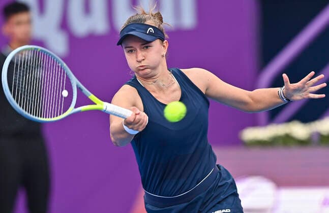 (220223) -- DOHA, Feb. 23, 2022 -- Barbora Krejcikova of Czech Republic hits a return during the second round of WTA, Tennis Damen Qatar Open tennis tournament match against Magda Linette of Poland at the Khalifa International Tennis Complex in Doha, capital of Qatar, on Feb. 22, 2022. (Photo by Nikku Xinhua) (SP)QATAR-DOHA-TENNIS-WTA QATAR OPEN-DAY 5 yangyuanyong 