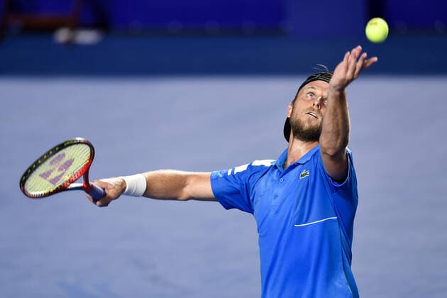 (220223) -- ACAPULCO, Feb. 23, 2022 -- Denis Kudla of the United States serves during the men s singles first round match against Rafael Nadal of Spain at the 2022 ATP, Tennis Herren Mexican Open tennis tournament in Acapulco, Mexico, Feb. 22, 2022. ) (SP)MEXICO-ACAPULCO-TENNIS-ATP-MEXICAN OPEN-FIRST ROUND XinxYuewei 