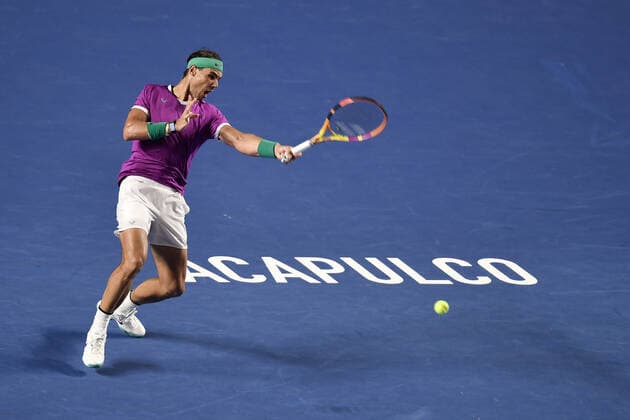 (220223) -- ACAPULCO, Feb. 23, 2022 -- Rafael Nadal of Spain hits a return during the men s singles first round match against Denis Kudla of the United States at the 2022 ATP, Tennis Herren Mexican Open tennis tournament in Acapulco, Mexico, Feb. 22, 2022. ) (SP)MEXICO-ACAPULCO-TENNIS-ATP-MEXICAN OPEN-FIRST ROUND XinxYuewei 