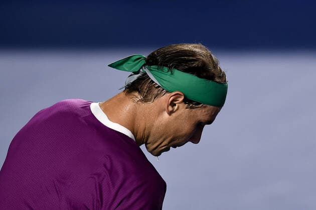 (220223) -- ACAPULCO, Feb. 23, 2022 -- Rafael Nadal of Spain reacts during the men s singles first round match against Denis Kudla of the United States at the 2022 ATP, Tennis Herren Mexican Open tennis tournament in Acapulco, Mexico, Feb. 22, 2022. ) (SP)MEXICO-ACAPULCO-TENNIS-ATP-MEXICAN OPEN-FIRST ROUND XinxYuewei 