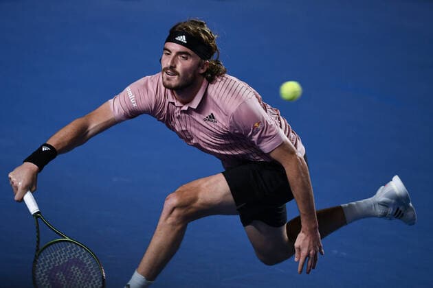 (220223) -- ACAPULCO, Feb. 23, 2022 -- Stefanos Tsitsipas of Greece hits a return during the men s singles first round match against Laslo Djere of Serbia at the 2022 ATP, Tennis Herren Mexican Open tennis tournament in Acapulco, Mexico, Feb. 22, 2022. ) (SP)MEXICO-ACAPULCO-TENNIS-ATP-MEXICAN OPEN-FIRST ROUND XinxYuewei 