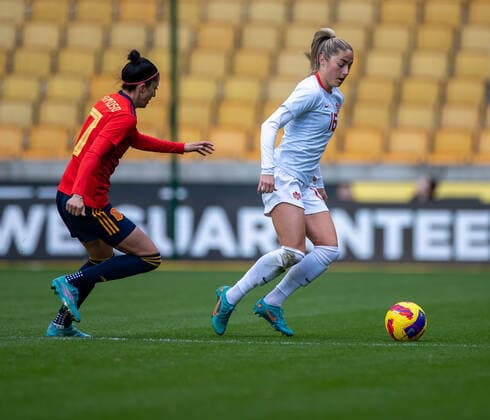 23rd February 2022 ; Molineux Stadium, Wolverhampton, West Midlands, England; Arnold Clark Womens International football Spain versus Canada; Janine Beckie of Canada tracked by Luc& xed;a Garc& xed;a Cordobe of Spain  ActionPlus12366376 RogerxEvans