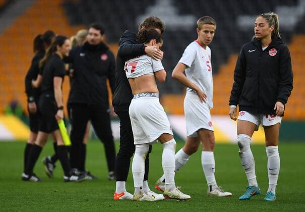 Mandatory Credit: Photo by Anna Gowthorpe Shutterstock (12819430bx) Jessie Fleming of Canada is consoled at full time Spain Women v Canada Women, Arnold Clark Cup 2022, Football, Molineux, Wolverhampton, UK - 23 Feb 2022 EDITORIAL USE ONLY No use with unauthorised audio, video, data, fixture lists, club league logos or live services. Online in-match use limited to 120 images, no video emulation. No use in betting, games or single club league player publications. Spain Women v Canada Women, Arnold Clark Cup 2022, Football, Molineux, Wolverhampton, UK - 23 Feb 2022 EDITORIAL USE ONLY No use with unauthorised audio, video, data, fixture lists, club league logos or live services. Online in-match use limited to 120 images, no video emulation. No use in betting, games or single club league player publications. Copyright: xAnnaxGowthorpe Shutterstockx 12819430bx