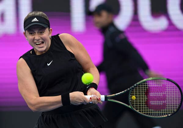 (220224) -- DOHA, Feb. 24, 2022 -- Jelena Ostapenko of Latvia hits a return during the round of 16 match of WTA, Tennis Damen Qatar Open tennis tournament between Jelena Ostapenko of Latvia and Barbora Krejcikova of Czech Republic at the Khalifa International Tennis Complex in Doha, capital of Qatar, on Feb. 23, 2022. Jelena Ostapenko won 6-3,6-2. (Photo by Xinhua) (SP)QATAR-DOHA-TENNIS-WTA QATAR OPEN-DAY 6 Nikku 