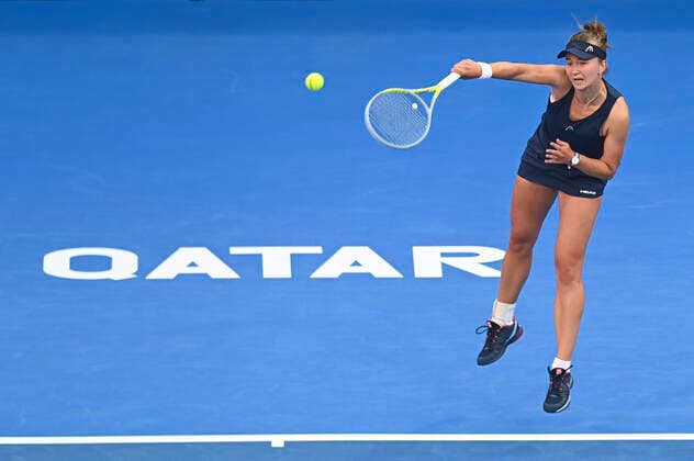 (220224) -- DOHA, Feb. 24, 2022 -- Barbora Krejcikova of the Czech Republic serves during the round of 16 match of WTA, Tennis Damen Qatar Open tennis tournament between Jelena Ostapenko of Latvia and Barbora Krejcikova of the Czech Republic at the Khalifa International Tennis Complex in Doha, capital of Qatar, on Feb. 23, 2022. (Photo by Xinhua) (SP)QATAR-DOHA-TENNIS-QATAR OPEN-ROUND OF 16 Nikku 