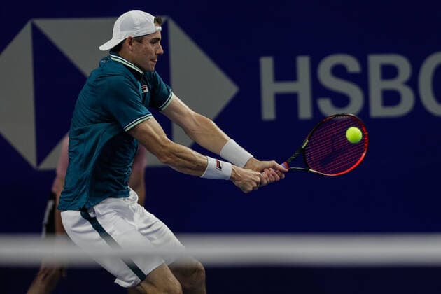 (220224) -- ACAPULCO, Feb. 24, 2022 -- John Isner of the United States hits a return during the men s singles round of 16 match between Cameron Norrie of Great Britain and John Isner of the United States at the 2022 ATP, Tennis Herren Mexican Open tennis tournament in Acapulco, Mexico, Feb. 23, 2022. (Photo by Xinhua) (SP)MEXICO-ACAPULCO-TENNIS-ATP-MEXICAN OPEN-ROUND OF 16 FranciscoxCanedo 