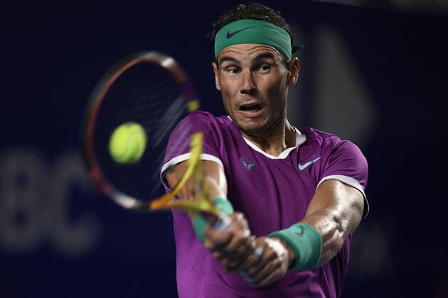(220224) -- ACAPULCO, Feb. 24, 2022 -- Rafael Nadal of Spain hits a return during the men s singles round of 16 match against Stefan Kozlov of the United States at the 2022 ATP, Tennis Herren Mexican Open tennis tournament in Acapulco, Mexico, Feb. 23, 2022. ) (SP)MEXICO-ACAPULCO-TENNIS-ATP-MEXICAN OPEN-ROUND OF 16 XinxYuewei 