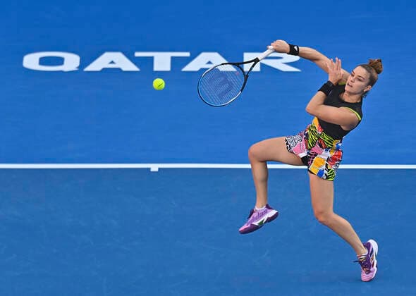 (220224) -- DOHA, Feb. 24, 2022 -- Maria Sakkari of Greece hits a return during the quarterfinal match of WTA, Tennis Damen Qatar Open tennis tournament between Maria Sakkari of Greece and Cori Gauff of the United States at the Khalifa International Tennis Complex in Doha, capital of Qatar, Feb. 24, 2022. (Photo by Nikku Xinhua) (SP)QATAR-DOHA-TENNIS-QATAR OPEN-QUARTERFINAL yangyuanyong 