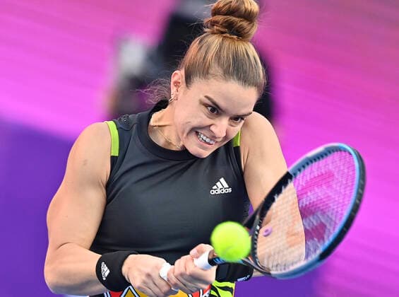 (220224) -- DOHA, Feb. 24, 2022 -- Maria Sakkari of Greece hits a return during the quarterfinal match of WTA, Tennis Damen Qatar Open tennis tournament between Maria Sakkari of Greece and Cori Gauff of the United States at the Khalifa International Tennis Complex in Doha, capital of Qatar, Feb. 24, 2022. (Photo by Nikku Xinhua) (SP)QATAR-DOHA-TENNIS-QATAR OPEN-QUARTERFINAL yangyuanyong 