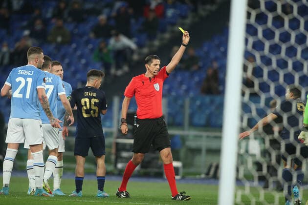 Rome, Italy - 24.02.2022: REFEREE Deniz Aytekin EXIT YELLOW CARD FOR MEHDI TAREMI (PORTO) during the UEFA Europa League Knockout Round Play-Offs Leg One soccer match between SS Lazio and Porto, at Olympic Stadium in Rome.  Copyright: xMarcoxIacobuccix xipa-agency.netx xMarcoxIacobuccix 0