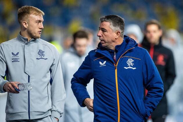 Mandatory Credit: Photo by Kirk O Rourke Rangers FC Shutterstock (12821153f) Rangers player Robby McCrorie and First team coach Roy Makaay walk round the pitch before the start of the last 32 Europa League match at Ibrox Stadium, Glasgow. Rangers v Borussia Dortmund, UEFA Europa League, Play-offs, Second Leg, Football, Ibrox Stadium, Glasgow, UK - 24 Feb 2022 Rangers v Borussia Dortmund, UEFA Europa League, Play-offs, Second Leg, Football, Ibrox Stadium, Glasgow, UK - 24 Feb 2022 Copyright: xKirkxO Rourke RangersxFC Shutterstockx 12821153f