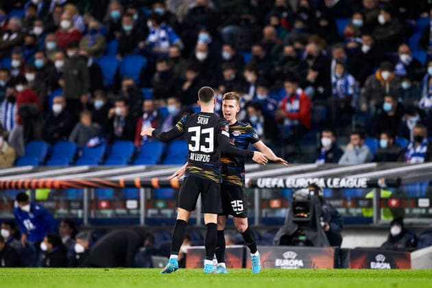 February 24, 2022, SAN SEBASTIAN, GUIPUZCOA, SPAIN: Andre Silva and Dani Olmo of RB Leipzig reacts after scoring goal during the UEFA Europa League Knockout Round Play-Offs Leg One match between, Real Sociedad and RB Leipzig at Reale Arena on 24 of February, 2022 in San Sebastian, Spain. SAN SEBASTIAN SPAIN - ZUMAa181 20220224_zaa_a181_034 Copyright: xRicardoxLarreinax