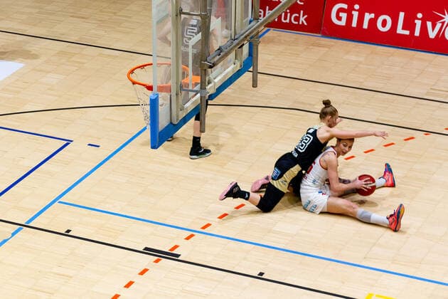 Basketball DBBL 18 match day GiroLive Panthers Osnabrück TK Hannover on 23 02 2022 in the OSC Hall in Osnabrück Milica Cuic Panthers Osnabrueck sits on the floor while Sasha Tarasava Hannover defends her PD