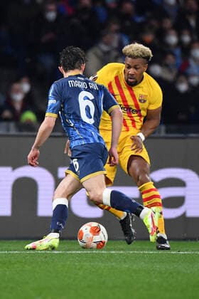Napoli s defender Mario Rui and Barcelona s forward Adama Traore in action during SSC Napoli vs FC Barcellona, football Europa League match in Naples, Italy, February 24 2022  Copyright: xCarmeloxImbesix xipa-agency.netx xx 0