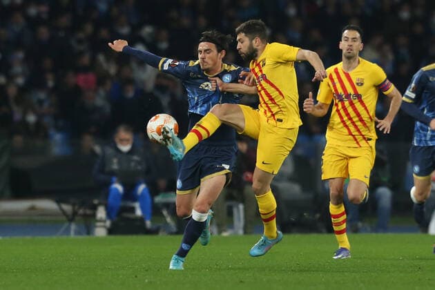 Italy: Europa League football match SSC Napoli vs Barcellona SSC Napoli s Macedonian midfielder Eljif Elmas challenges for the ball with Barcellona s Spanish defender Jordi Alba during the UEFA Europa League football match between SSC Napoli and Barcellona at the Diego Armando Maradona Stadium in Naples, southern Italy, on February 24, 2022. ABPH8835 Copyright: xAntonioxBalascox
