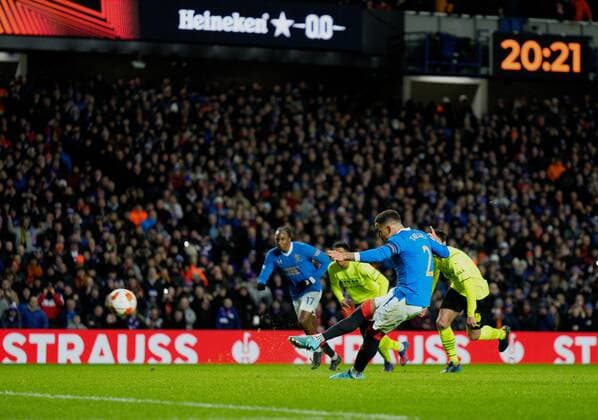 Mandatory Credit: Photo by Stuart Wallace Shutterstock (12820548i) Rangers captain James Tavernier scores from the penalty spot to give Rangers a 1-0 lead (agg. 5-2). Rangers v Borussia Dortmund, UEFA Europa League, Play-offs, Second Leg, Football, Ibrox Stadium, Glasgow, UK - 24 Feb 2022 EDITORIAL USE ONLY No use with unauthorised audio, video, data, fixture lists, club league logos or live services. Online in-match use limited to 120 images, no video emulation. No use in betting, games or single club league player publications. Rangers v Borussia Dortmund, UEFA Europa League, Play-offs, Second Leg, Football, Ibrox Stadium, Glasgow, UK - 24 Feb 2022 EDITORIAL USE ONLY No use with unauthorised audio, video, data, fixture lists, club league logos or live services. Online in-match use limited to 120 images, no video emulation. No use in betting, games or single club league player publications. Copyright: xStuartxWallace Shutterstockx 12820548i