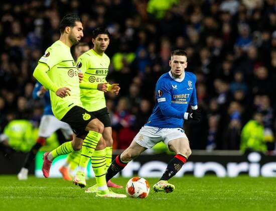 Mandatory Credit: Photo by Luke Nickerson Rangers FC Shutterstock (12821152ab) Rangers Forward Ryan Kent puts pressure on Borussia Dortmund Midfielder Emre Can Rangers v Borussia Dortmund, UEFA Europa League, Play-offs, Second Leg, Football, Ibrox Stadium, Glasgow, UK - 24 Feb 2022 Rangers v Borussia Dortmund, UEFA Europa League, Play-offs, Second Leg, Football, Ibrox Stadium, Glasgow, UK - 24 Feb 2022 Copyright: xLukexNickerson RangersxFC Shutterstockx 12821152ab