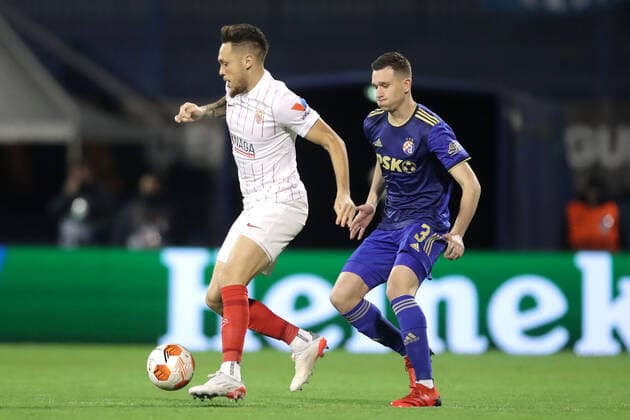Dinamo Zagreb v Sevilla FC: Knockout Round Play-Offs Leg Two - UEFA Europa League ZAGREB, CROATIA - FEBRUARY 24: Lucas Ocampos of Sevilla FC and Daniel Stefulj of Dinamo Zagreb in action during the UEFA Europa League Knockout Round Play-Offs Leg Two match between Dinamo Zagreb and Sevilla FC at Maksimir Stadium on February 24, 2022 in Zagreb, Croatia. LukaxStanzl PIXSELL