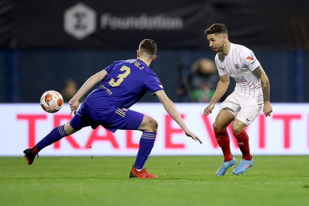 Dinamo Zagreb v Sevilla FC: Knockout Round Play-Offs Leg Two - UEFA Europa League ZAGREB, CROATIA - FEBRUARY 24: Daniel Stefulj of Dinamo Zagreb and Gonzalo Montiel of Sevilla FC in action during the UEFA Europa League Knockout Round Play-Offs Leg Two match between Dinamo Zagreb and Sevilla FC at Maksimir Stadium on February 24, 2022 in Zagreb, Croatia. IgorxKralj PIXSELL