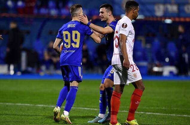 Dinamo Zagreb v Sevilla FC: Knockout Round Play-Offs Leg Two - UEFA Europa League ZAGREB, CROATIA - FEBRUARY 24: Amer Gojak and Mislav Orsic of Dinamo Zagreb celebrates a goal during the UEFA Europa League Knockout Round Play-Offs Leg Two match between Dinamo Zagreb and Sevilla FC at Maksimir Stadium on February 24, 2022 in Zagreb, Croatia. MarkoxLukunic PIXSELL