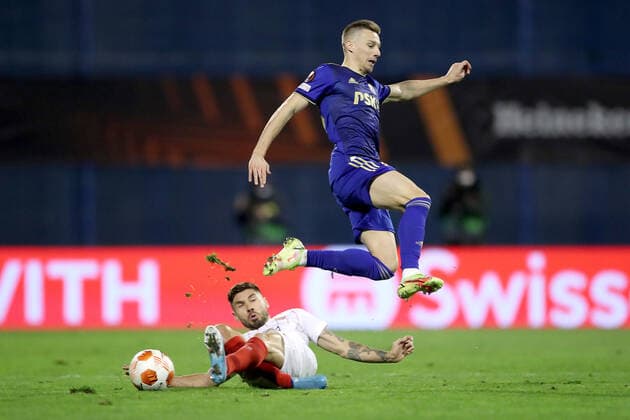 Dinamo Zagreb v Sevilla FC: Knockout Round Play-Offs Leg Two - UEFA Europa League ZAGREB, CROATIA - FEBRUARY 24: Mislav Orsic of Dinamo Zagreb and Gonzalo Montiel of Sevilla FC in action during the UEFA Europa League Knockout Round Play-Offs Leg Two match between Dinamo Zagreb and Sevilla FC at Maksimir Stadium on February 24, 2022 in Zagreb, Croatia. IgorxKralj PIXSELL