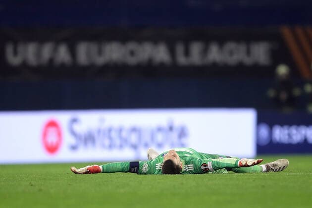 Dinamo Zagreb v Sevilla FC: Knockout Round Play-Offs Leg Two - UEFA Europa League ZAGREB, CROATIA - FEBRUARY 24: Golakeeper of Dinamo Zagreb Dominik Livakovic lying on a pitch during the UEFA Europa League Knockout Round Play-Offs Leg Two match between Dinamo Zagreb and Sevilla FC at Maksimir Stadium on February 24, 2022 in Zagreb, Croatia. LukaxStanzl PIXSELL