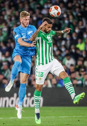 SEVILLE, SPAIN â€“ FEBRUARY 24, 2022: Zenit St Petersburg s Dmitry Chistyakov (L) and Betis s Willian Jose jump to head the ball in the second leg of a UEFA Europa League playoff fooball match between Betis and Zenit St Petersburg at Benito Villamarin Stadium. Alexander Demianchuk TASS  TS1254E1