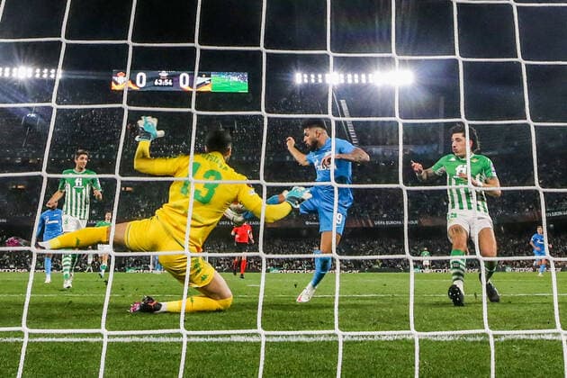SEVILLE, SPAIN â€“ FEBRUARY 24, 2022: Betis s goalkeeper Rui Silva (front), Zenit St Petersburg s Yuri Alberto (C back) and Betis s Hector Bellerin (R back) in the second leg of a UEFA Europa League playoff fooball match between Betis and Zenit St Petersburg at Benito Villamarin Stadium. The second leg ended in a 0-0 draw. Betis won the match. Alexander Demianchuk TASS  TS1254EF