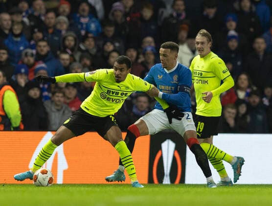 Football - 2021 2022 UEFA Europa League - Round of 32 - Second Leg - Glasgow Rangers vs Borussia Dortmund - Ibrox Stadium - Thursday 24th February 2022. Donyell Malen of Borussia Dortmund vies with James Tavernier of Rangers 