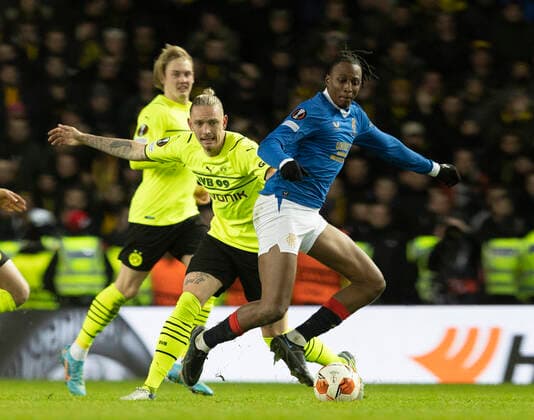 Football - 2021 2022 UEFA Europa League - Round of 32 - Second Leg - Glasgow Rangers vs Borussia Dortmund - Ibrox Stadium - Thursday 24th February 2022. Joe Aribo of Rangers vies with Marius Wolf of Borussia Dortmund 