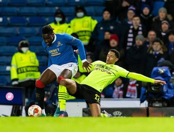 Mandatory Credit: Photo by Luke Nickerson Rangers FC Shutterstock (12821152ad) Rangers Defender Calvin Bassey is tackled by Borussia Dortmund Midfielder Jude Bellingham Rangers v Borussia Dortmund, UEFA Europa League, Play-offs, Second Leg, Football, Ibrox Stadium, Glasgow, UK - 24 Feb 2022 Rangers v Borussia Dortmund, UEFA Europa League, Play-offs, Second Leg, Football, Ibrox Stadium, Glasgow, UK - 24 Feb 2022  Copyright: xLukexNickerson RangersxFC Shutterstockx 12821152ad