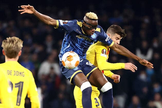 NAPLES, ITALY – FEBRUARY 24: Victor Osimhen of SSC Napoli vies with Gerard Pique of FC Barcelona, Barca during the UEFA Europa League match between SSC Napoli and FC Barcelona at Stadio Diego Armando Maradona on February 24, 2022 in Naples, Italy Copyright: xFotoagenziax