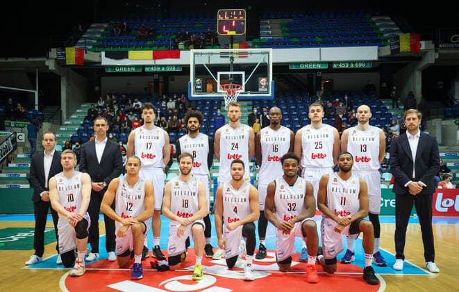 Belgium s assistant coach Frederic Wilmot, Belgium s head coach Dario Gjergja, Belgium s Hans Vanwijn, Belgium s Jean-Marc Mwema, Belgium s Andy Vanvliet, Belgium s Kevin Tumba, Belgium s Haris Bratanovic, Belgium s Pierre-Antoine Gillet, Belgium s assistant coach Olivier Foucart, Belgium s Quentin Serron, Belgium s Jean Salumu, Belgium s Alexandre Libert, Belgium s Emmanuel Lecomte, Belgium s Retin Obasohan and Belgium s Loic Schwartz poses for the photographer at the start of a match between the Belgian national men team the Belgian Lions and Latvia, a qualifier match in Group A, ahead of the World Cup Basketball, Friday 25 February 2022, in Mons. VIRGINIExLEFOUR x13779591x