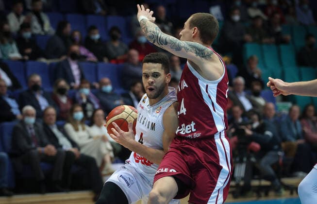 Belgium s Emmanuel Lecomte and Latvian Andrejs Grazulis fight for the ball during a match between the Belgian national men team the Belgian Lions and Latvia, a qualifier match in Group A, ahead of the World Cup Basketball, Friday 25 February 2022, in Mons. VIRGINIExLEFOUR  x13792845x