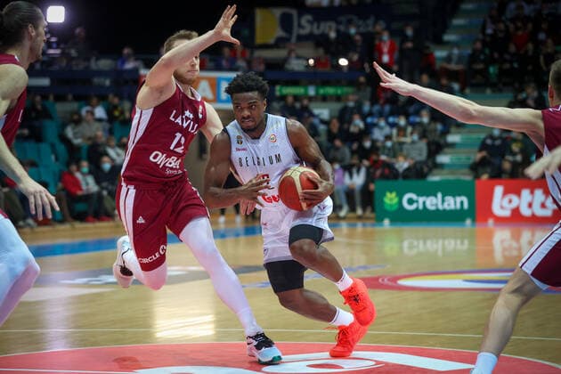 Latvian Arturs Strautins and Belgium s Retin Obasohan fight for the ball during a match between the Belgian national men team the Belgian Lions and Latvia, a qualifier match in Group A, ahead of the World Cup Basketball, Friday 25 February 2022, in Mons. VIRGINIExLEFOUR  x13805012x