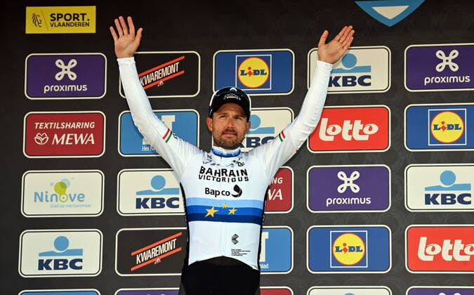 Italian Sonny Colbrelli of Bahrain Victorious celebrates on the podium of the men s elite race of the Omloop Het Nieuwsblad one-day cycling race, 204,2km from Gent to Ninove, Saturday 26 February 2022. DAVIDxSTOCKMAN  x14212770x