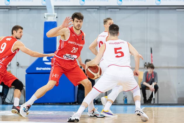 27 02 2022, Fribourg, Hall St Leonard, FIBA Men x92 s EuroBasket 2025 Pre Qualification Switzerland Austria, 20 Arnaud Cotture Switzerland dÃ fend face Ã 5 Bogic Vujosevic Austria Fribourg Hall St Leonard Fribourg Switzerland  Copyright: xJustPictures.ch SirianexDavetx