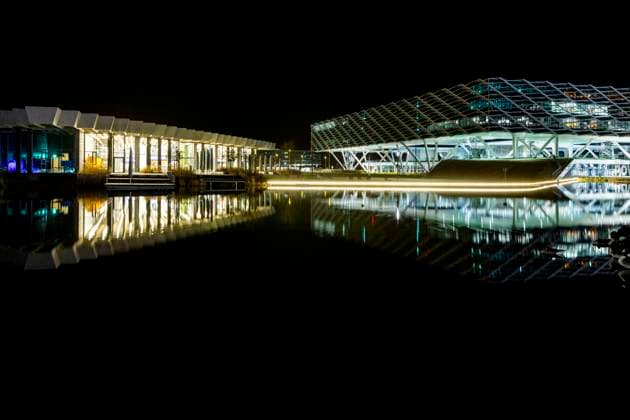 Image series The adidas Campus in Herzogenaurach at night The Halftime Links and Arena buildings are reflected in the artificial lake Herzogenaurach Bavaria Germany