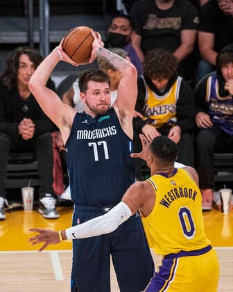 March 1, 2022, Los Angeles, California, USA: Luka Doncic 77 of the Dallas Mavericks looks to pass the ball over Russell Westbrook 0 of the Los Angeles Lakers during their NBA, Basketball Herren, USA game on Tuesday March 1, 2022 at Crypto.com Arena in Los Angeles, California. Lakers lose to Mavericks, 104-109. PI Los Angeles USA - ZUMAp124 20220301_zaa_p124_006 Copyright: xJAVIERxROJASx