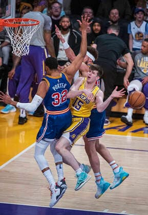 March 5, 2022, Los Angeles, California, USA: Austin Reaves 15 of the Los Angeles Lakers is fouled as he goes up for a basket during their NBA, Basketball Herren, USA game against the Golden State Warriors on Saturday March 5, 2022 at Crypto.com Arena in Los Angeles, California. PI Los Angeles USA - ZUMAp124 20220305_zaa_p124_004 Copyright: xJAVIERxROJASx