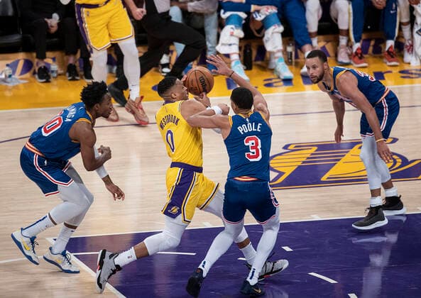 March 5, 2022, Los Angeles, California, USA: Russell Westbrook 0 of the Los Angeles Lakers drives against Jordan Poole 3 of the Golden State Warriors for a basket during their NBA, Basketball Herren, USA game on Saturday March 5, 2022 at Crypto.com Arena in Los Angeles, California. Lakers defeat Warriors, 124-116. PI Los Angeles USA - ZUMAp124 20220305_zaa_p124_026 Copyright: xJAVIERxROJASx