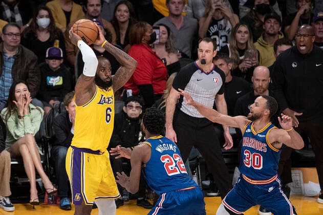 March 5, 2022, Los Angeles, California, USA: Stephen Curry 30 and Andrew Wiggins 22 of the Golden State Warriors defends against LeBron James 6 of the Los Angeles Lakers during their NBA, Basketball Herren, USA game on Saturday March 5, 2022 at Crypto.com Arena in Los Angeles, California. Lakers defeat Warriors, 124-116. PI Los Angeles USA - ZUMAp124 20220305_zaa_p124_041 Copyright: xJAVIERxROJASx