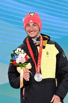 Paralympics Beijing 2022 Super G Beijing CHINA 06 03 22 Competition Day 2 Zhangjiakou Medal Plaza Award Ceremony Para Biathlon Sprint MAIER, Marco GER from SV Kirchzarten BAD , born 20 12 1999 in Oberstdorf, Paralympic classification LW8 standing wins silver Credit Ralf Kuckuck, DBS Yanging National Alpine Ski Center China