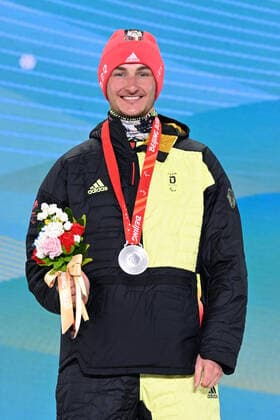 Paralympics Beijing 2022 Super G Beijing CHINA 06 03 22 Competition Day 2 Zhangjiakou Medal Plaza Award Ceremony Para Biathlon Sprint MAIER, Marco GER from SV Kirchzarten BAD , born 20 12 1999 in Oberstdorf, Paralympic classification LW8 standing wins silver Credit Ralf Kuckuck, DBS Yanging National Alpine Ski Center China