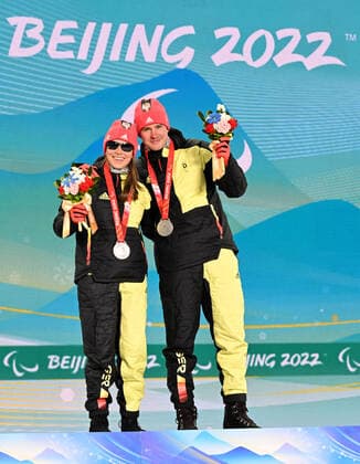 Paralympics Beijing 2022 Super G Beijing CHINA 06 03 22 Competition Day 2 Zhangjiakou Medal Plaza Award Ceremony Para Biathlon Sprint WALTER, Leonie GER of SC St Peter BAD , born 17 10 2004 in Freiburg, Paralympic classification B2 and STRECKER, Pirmin GER of SV Kirchzarten BAD , born 17 06 2002 in Freiburg, Paralympic classification Guide Leonie Walter win Bronze Credit Ralf Kuckuck, DBS Yanging National Alpine Ski Center China