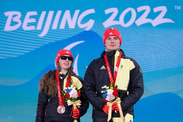 Paralympics Beijing 2022 Super G Beijing CHINA 06 03 22 Competition Day 2 Zhangjiakou Medal Plaza Award Ceremony Para Biathlon Sprint WALTER, Leonie GER of SC St Peter BAD , born 17 10 2004 in Freiburg, Paralympic classification B2 and STRECKER, Pirmin GER of SV Kirchzarten BAD , born 17 06 2002 in Freiburg, Paralympic classification Guide Leonie Walter win Bronze Credit Ralf Kuckuck, DBS Yanging National Alpine Ski Center China