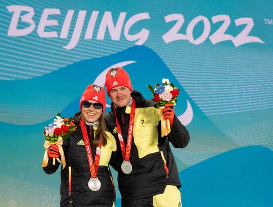 Paralympics Beijing 2022 Super G Beijing CHINA 06 03 22 Competition Day 2 Zhangjiakou Medal Plaza Award Ceremony Para Biathlon Sprint WALTER, Leonie GER of SC St Peter BAD , born 17 10 2004 in Freiburg, Paralympic classification B2 and STRECKER, Pirmin GER of SV Kirchzarten BAD , born 17 06 2002 in Freiburg, Paralympic classification Guide Leonie Walter win Bronze Credit Ralf Kuckuck, DBS Yanging National Alpine Ski Center China