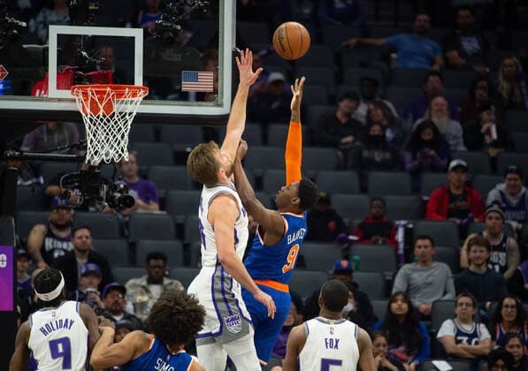 March 7, 2022, Sacramento, CA, USA: Sacramento Kings forward Domantas Sabonis (10) blocks shot by New York Knicks guard RJ Barrett (9) during a game at Golden 1 Center in Sacramento, Monday, March 7, 2022. Sacramento USA - ZUMAj89_ 0152635877st Copyright: xPaulxKitagakixJr.x